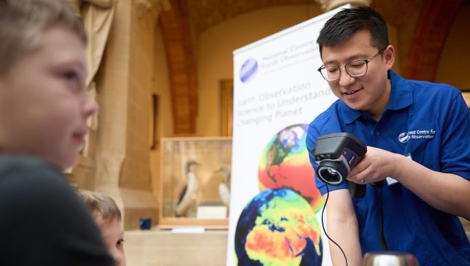 Scientist demonstrating a thermal camera